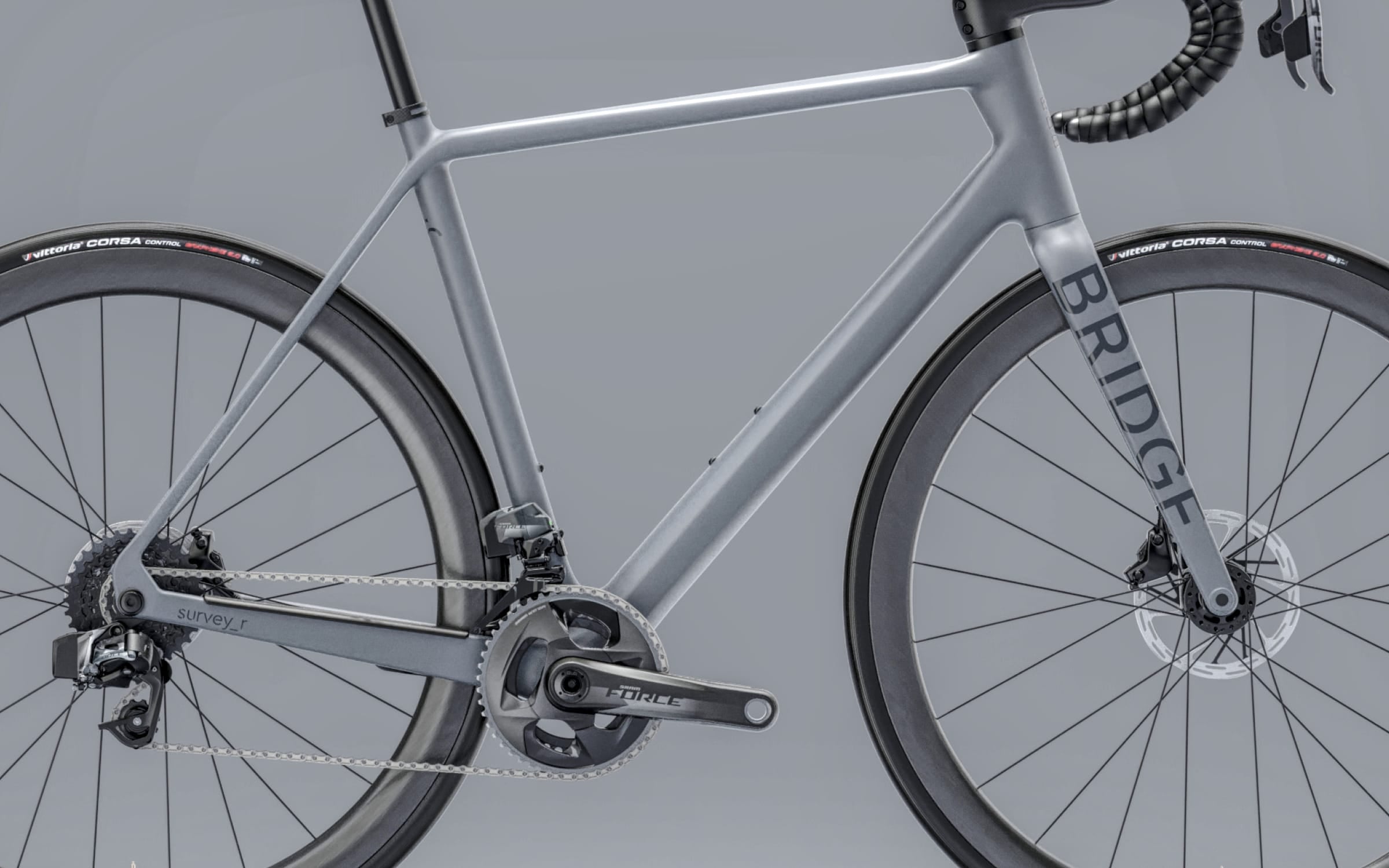 gray framed racing bike on a gray background.